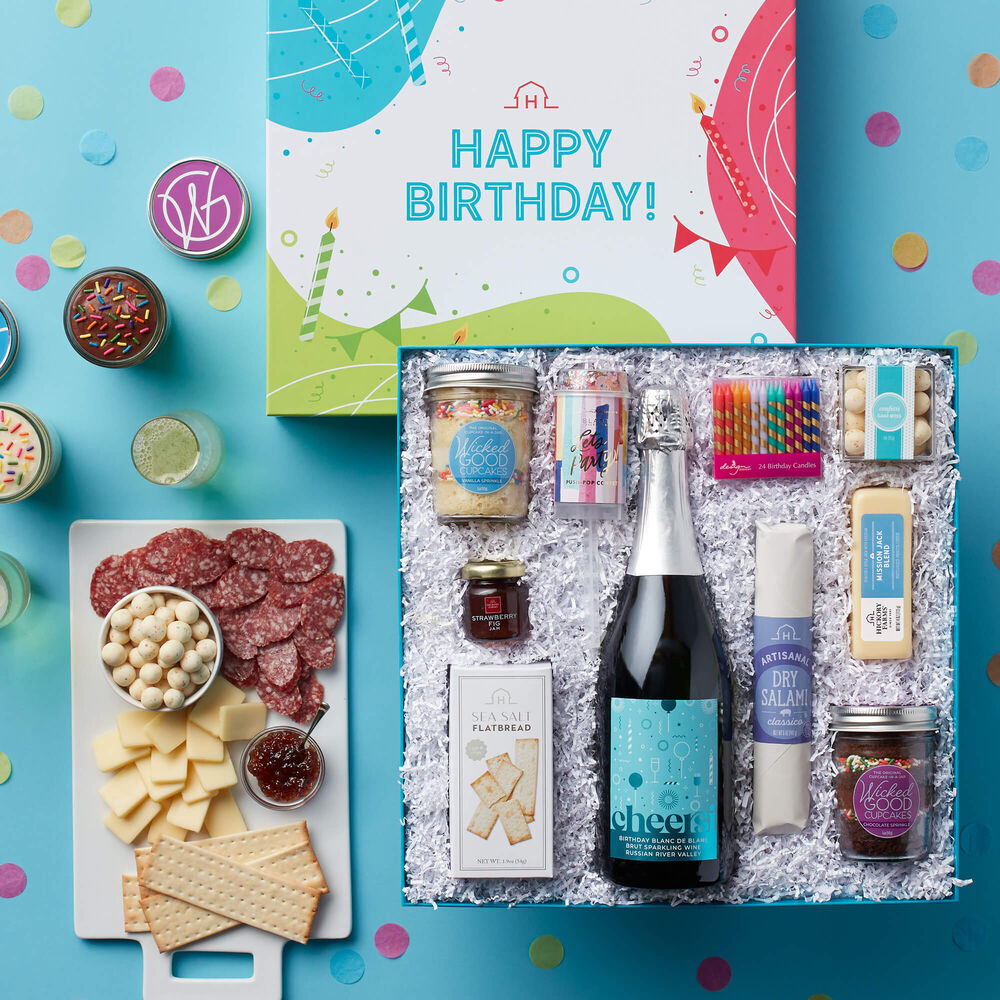 The Let&#39;s Party Birthday Gift Box contains Vanilla and Chocolate Sprinkle Cupcakes, Dry Salami, Mission Jack Blend, Strawberry Fig Jam, Sea Salt Flatbread, Confetti Cake Bites, and Sparkling Wine